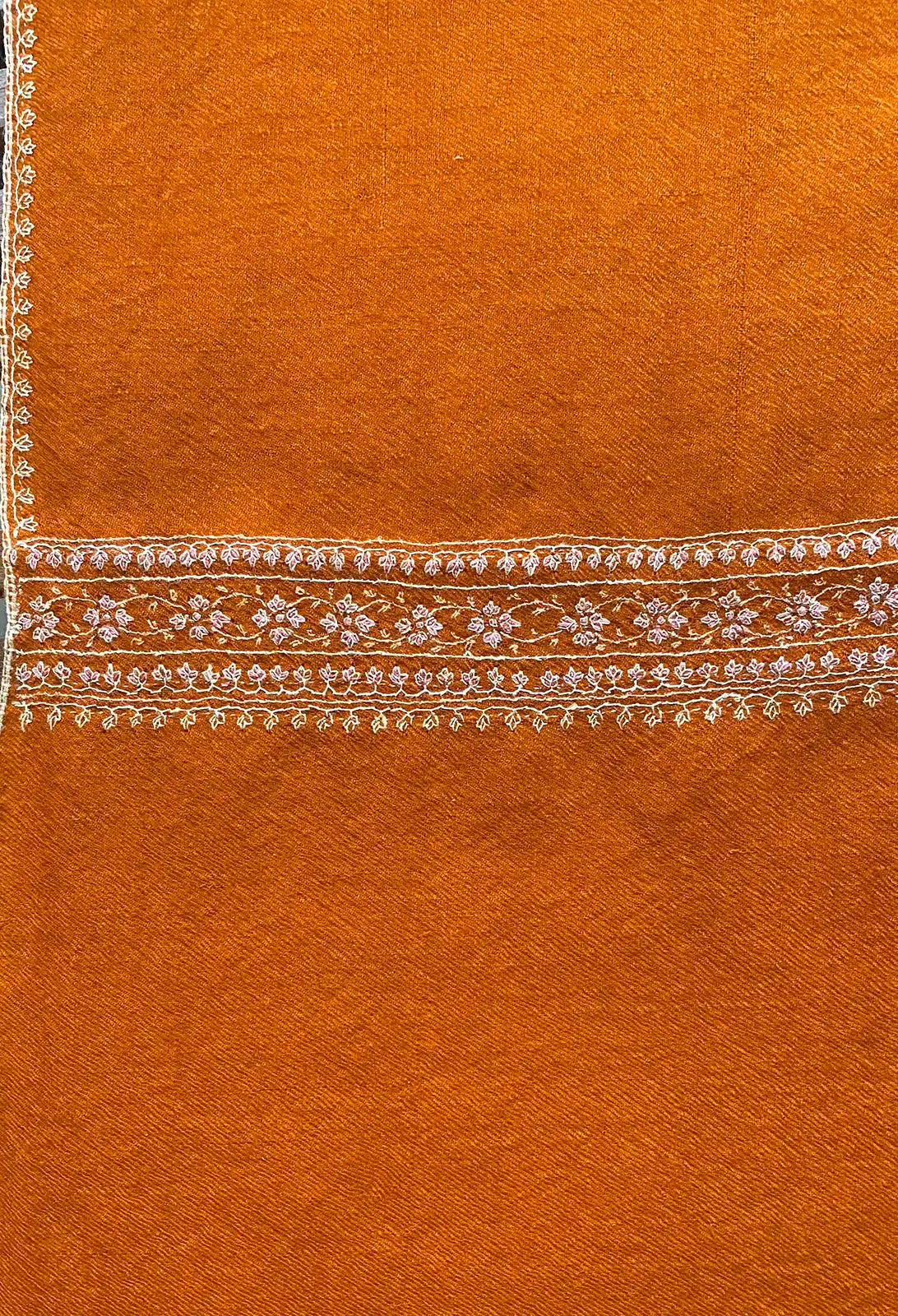 Pashmina stole in burnt orange with light border embroidery