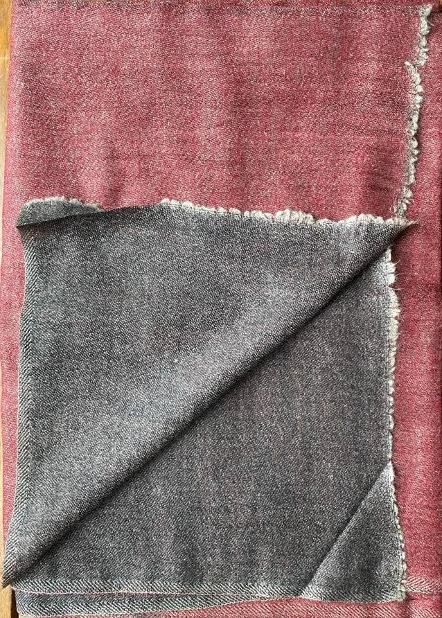 Since the 1860s, the reversible "dorukha" Pashmina stoles have been a beloved product of Kashmir. This double-sided stole, made from 100% cashmere, is light, soft, and exquisite. It is hand-woven on a traditional loom and is a popular choice for both men and women. The classic Pashmina is one of our best sellers, ideal for semi-casual occasions, city dressing, and winter days in the mountains.