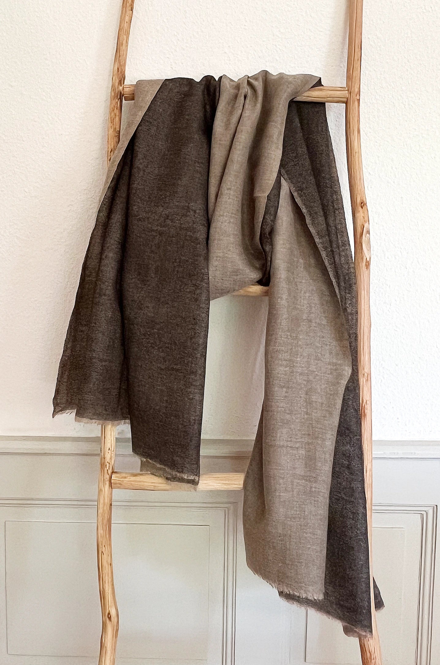 Since the 1860s, the reversible "dorukha" Pashmina stoles have been a beloved product of Kashmir. This double-sided stole, made from 100% cashmere, is light, soft, and exquisite. It is hand-woven on a traditional loom and is a popular choice for both men and women. The classic Pashmina is one of our best sellers, ideal for semi-casual occasions, city dressing, and winter days in the mountains.