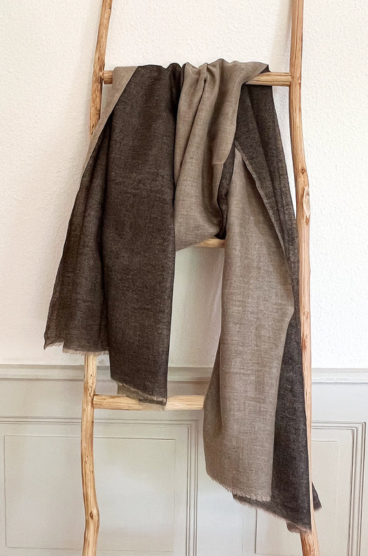 Since the 1860s, the reversible "dorukha" Pashmina stoles have been a beloved product of Kashmir. This double-sided stole, made from 100% cashmere, is light, soft, and exquisite. It is hand-woven on a traditional loom and is a popular choice for both men and women. The classic Pashmina is one of our best sellers, ideal for semi-casual occasions, city dressing, and winter days in the mountains.