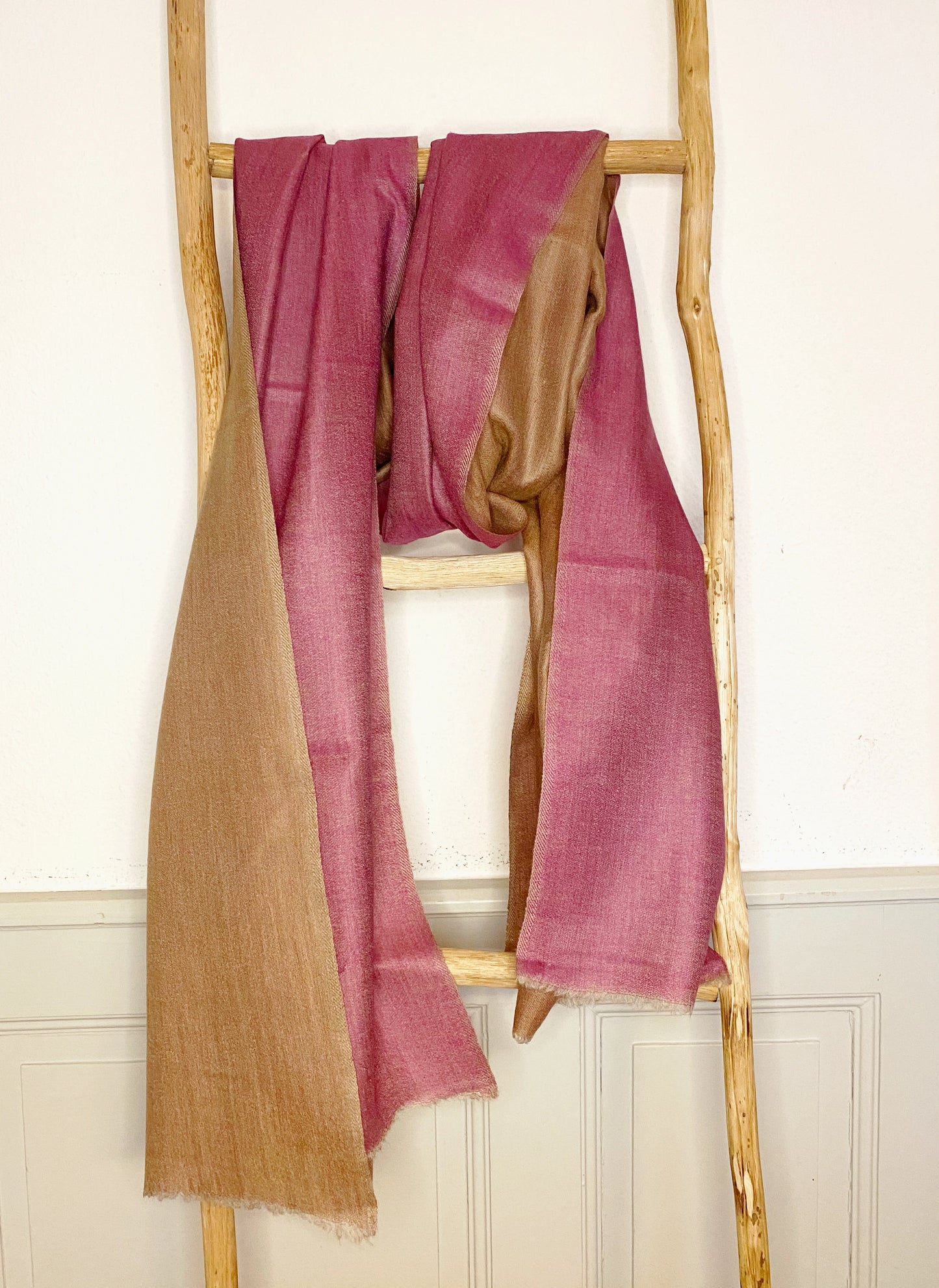 Since the 1860s, the reversible "dorukha" Pashmina stoles have been a beloved product of Kashmir. This double-sided stole, made from 100% cashmere, is light, soft, and exquisite. It is hand-woven on a traditional loom and is a popular choice for both men and women. The classic Pashmina is one of our best sellers, ideal for semi-casual occasions, city dressing, and winter days in the mountains.