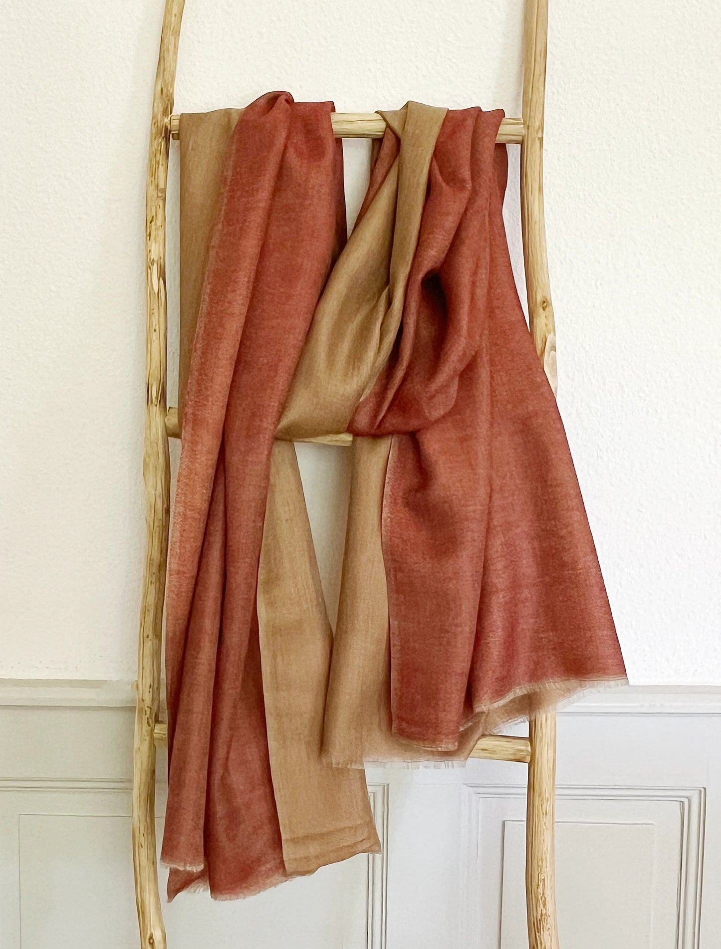 Since the 1860s, the reversible "dorukha" Pashmina stoles have been a beloved product of Kashmir. This double-sided stole, made from 100% cashmere, is light, soft, and exquisite. It is hand-woven on a traditional loom and is a popular choice for both men and women. The classic Pashmina is one of our best sellers, ideal for semi-casual occasions, city dressing, and winter days in the mountains.